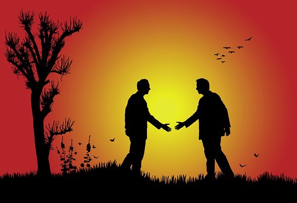 Business Men Silhouetted Under The Sunset