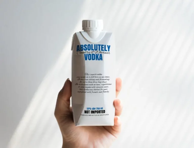 Hand Holding Paper Bottle Packaging Mockup