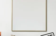 Golden Photo Frame in Dining Room PSD Mockup